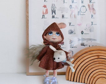 25 cm. Handmade doll with knitted dress and hat. Interior doll with bunny. Fits for gift, present, interior. Fabric doll handmade.