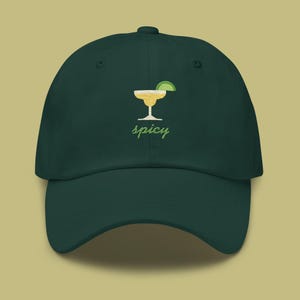 May include: A dark green baseball cap with an embroidered image of a margarita glass with a lime wedge and the word "spicy" underneath.