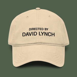 May include: A set of three ceramic mugs with a speckled, matte finish. The mugs are in shades of cream, light gray, and dark gray. Each mug has a simple, minimalist design, perfect for coffee or tea.