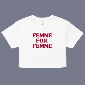 May include: White cropped t-shirt with the text "FEMME FOR FEMME" in red.