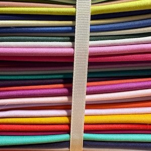 44 Fat Quarter bundle of Tula Pink&#39;s Designer Essentials Solids. Gorgeous bright colors to make your projects sparkle.
