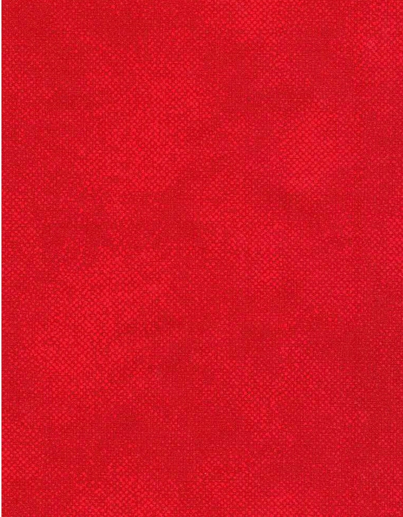 May include: A solid red fabric with a textured, woven appearance. The close-up view reveals a subtle pattern of small squares, creating a visually interesting surface. The color is a vibrant, saturated red.
