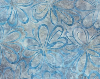 May include: A fabric featuring a repeating pattern of stylized blue flowers with open, flowing petals. The background consists of a mottled, textured wash of light gray and muted blue tones, creating a soft, layered appearance across the surface.