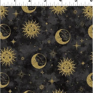 May include: A black fabric with a gold glitter pattern of suns, moons, and stars. The pattern is repeated throughout the fabric.