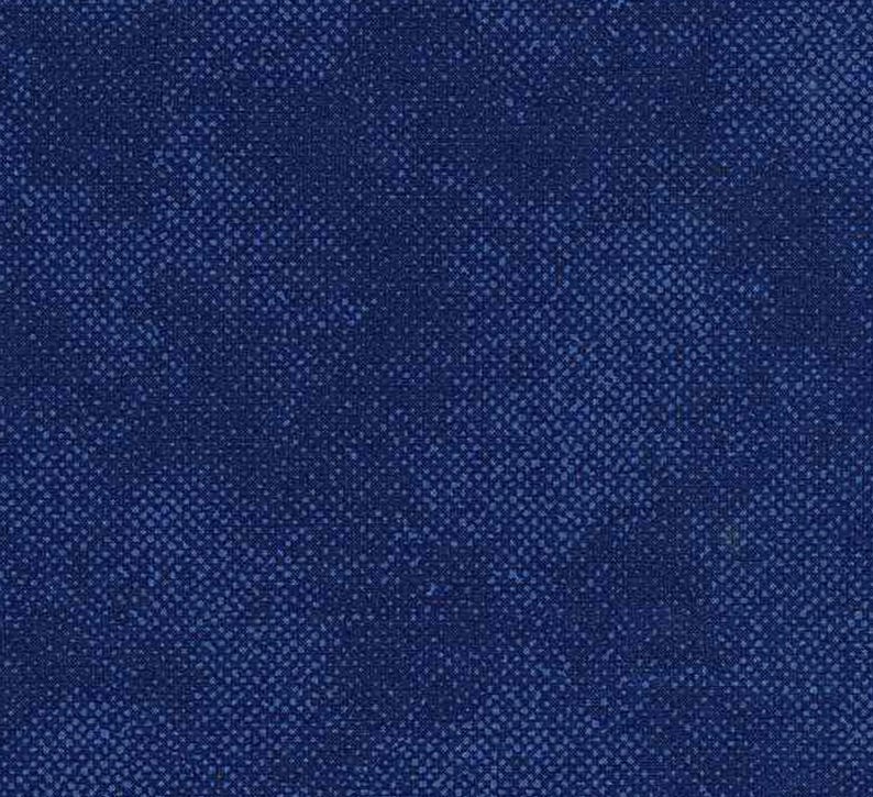 May include: A close-up of a textured fabric in shades of blue. The fabric has a subtle, crosshatched pattern, creating a visual texture. The color palette ranges from deep navy to lighter blue tones.