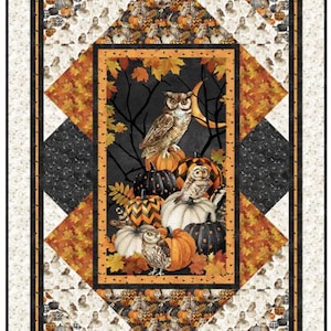 May include: A rectangular quilt featuring a central panel with owls perched on pumpkins against a dark background with a crescent moon. The border includes orange maple leaves, black patterned diamonds, and a cream-colored outer frame with owls.