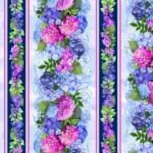 May include: Floral fabric with vertical stripes featuring pink, blue, and purple hydrangea blooms. Green leaves and stems accent the flowers against a light blue background. The stripes are bordered by dark blue lines.