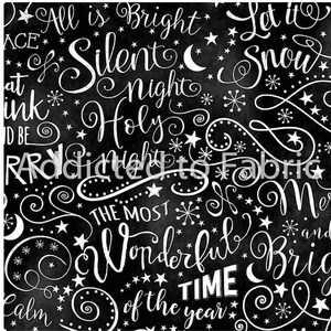 May include: Black fabric with white script and illustrations. The text includes phrases like "All is Bright," "Silent Night," and "Wonderful Time of the Year." Stars, snowflakes, and crescent moons are also featured.