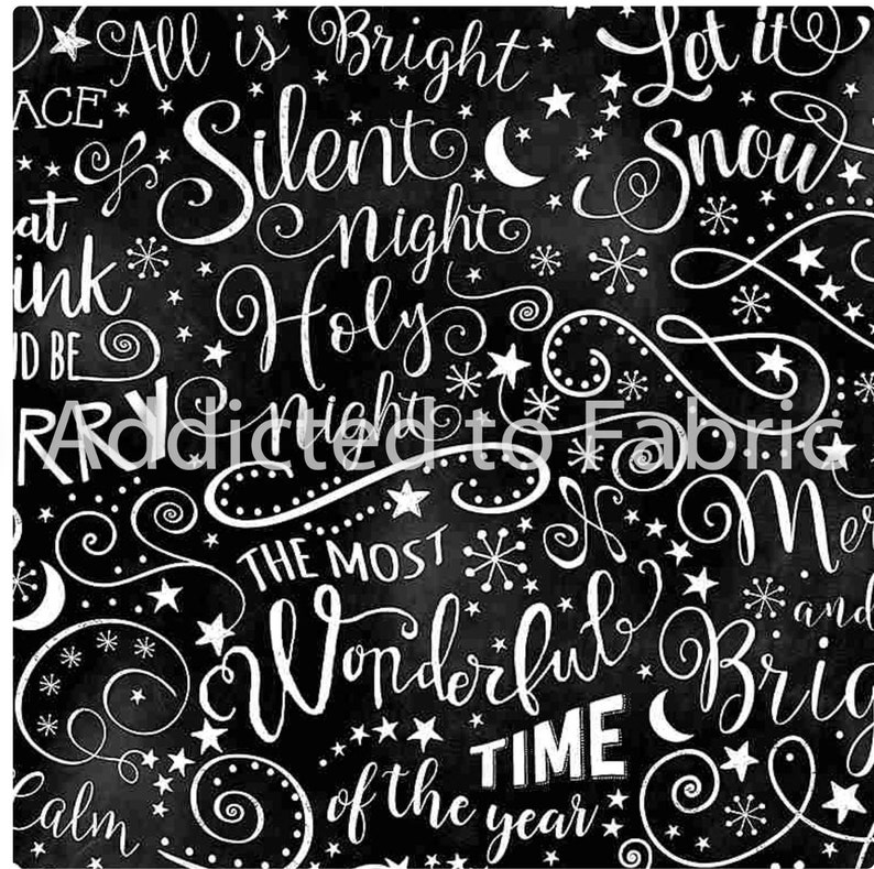 May include: Black fabric with white script and illustrations. The text includes phrases like "All is Bright," "Silent Night," and "Wonderful Time of the Year." Stars, snowflakes, and crescent moons are also featured.