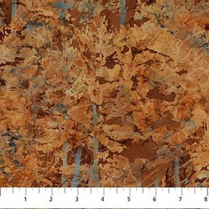 May include: A fabric with a mottled pattern in shades of brown, tan, and rust, with streaks of blue. The fabric is measured with a ruler showing inches.