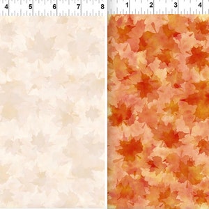 May include: Two fabric swatches with a pattern of watercolor-style maple leaves. The left swatch is a light beige with a subtle pattern of leaves. The right swatch is a vibrant orange and red with a more prominent pattern of leaves.