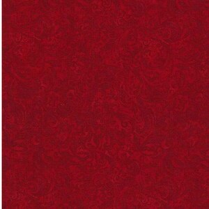 May include: A solid red fabric with a marbled pattern. The fabric has a subtle texture and a rich, deep red color.