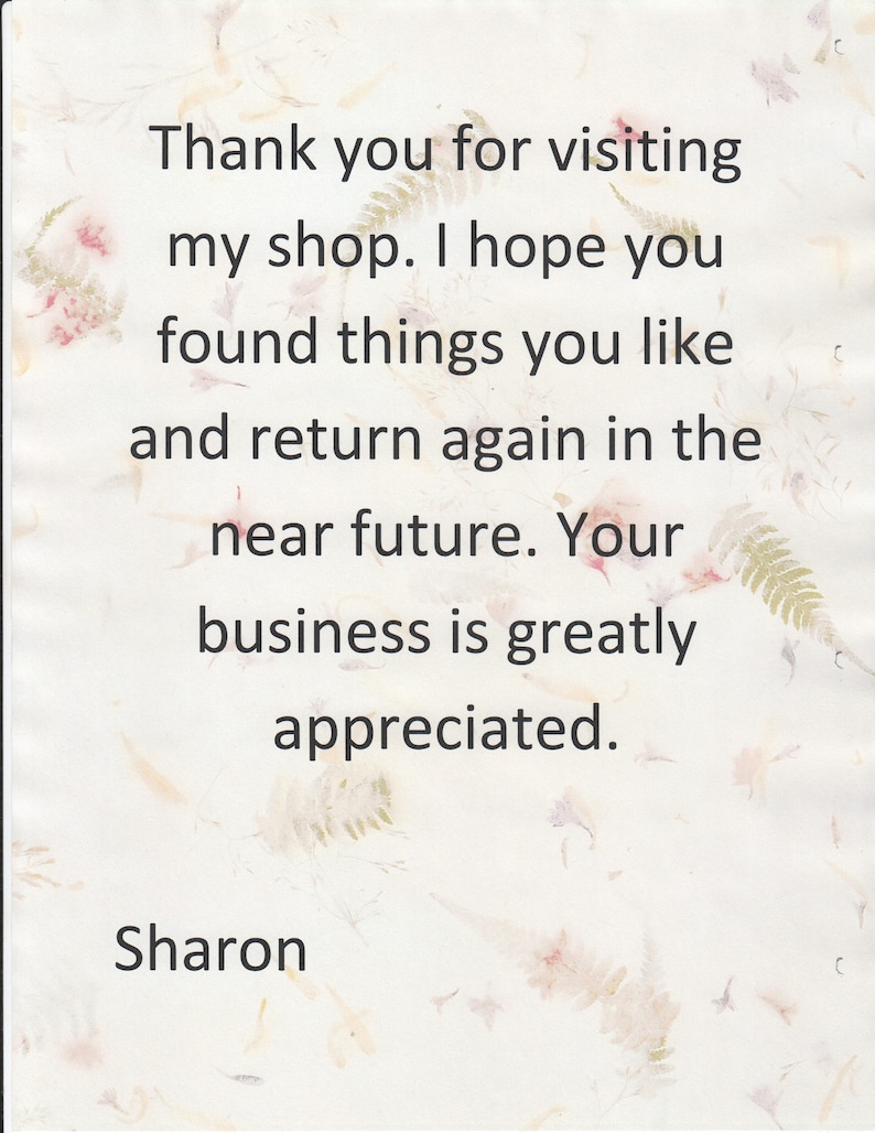 May include: A white card featuring a subtle, light-coloured pressed leaf and floral pattern. The text reads: Thank you for visiting my shop. I hope you found things you like and return again in the near future. Your business is greatly appreciated. Sharon.