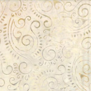May include: A cream-colored fabric featuring a repeating pattern of light brown and soft gray swirling paisley motifs and delicate dotted lines. The textile has a subtle mottled texture throughout, creating a soft, layered appearance across the surface.