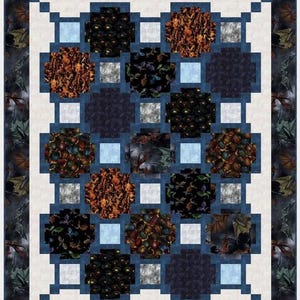 May include: A quilt block with a blue border and a white background. The block is made up of 16 smaller squares, each with a different dragon-themed fabric. The fabrics feature various colors, including black, brown, orange, and green.
