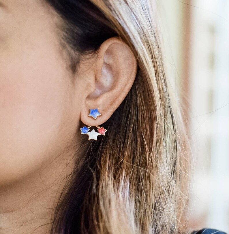 Profile shot of model wearing star earrings inspired by American flag colors, perfect for 4th of July festivities.