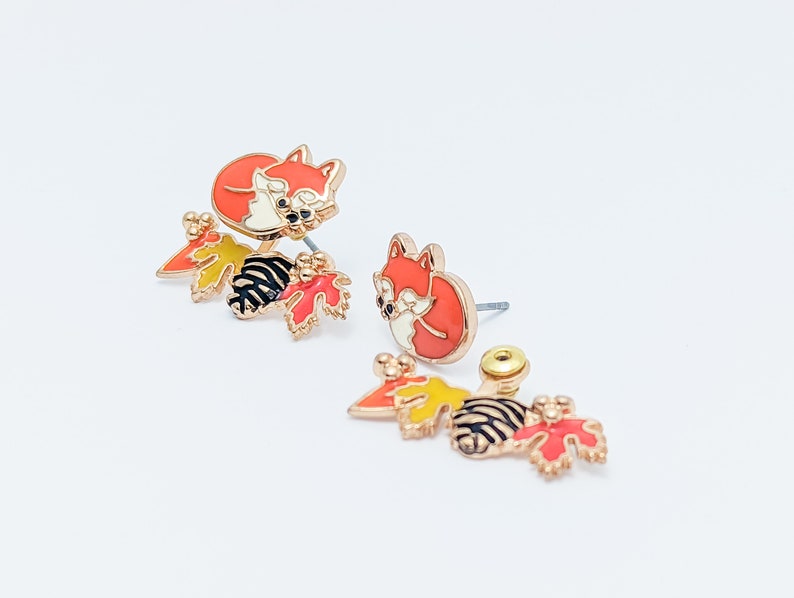 Side profile view of the red fox front back earrings, showcasing the surgical grade stainless steel post and gold plating edge.