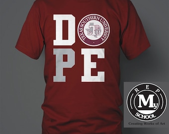 May include: A maroon t-shirt with the word "DOPE" printed in white letters. The "O" is replaced with the Texas Southern University logo. The logo is a circle with the words "Texas Southern University" around the outside and a tiger head inside. The words "REP MY SCHOOL" are printed in white letters on a black circle with a white "M" in the center. The words "Creating Works of Art" are printed below the circle.
