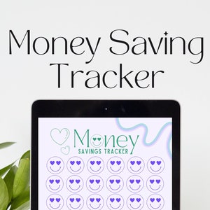 May include: A digital tablet screen displaying a money saving tracker with a pink background and a green heart with the word "Money" and the words "Savings Tracker". The tracker has 40 purple smiley faces with hearts for eyes. The text "AMOUNT" and "GOAL DATE" are at the bottom of the screen.