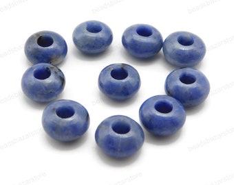 May include: Ten blue gemstone beads with a hole in the center. The beads are round and have a smooth, polished finish.