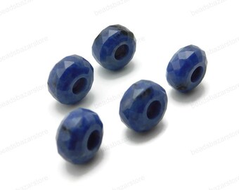 May include: Six faceted blue gemstone beads with a hole in the center for stringing. The beads are approximately 10mm in diameter.
