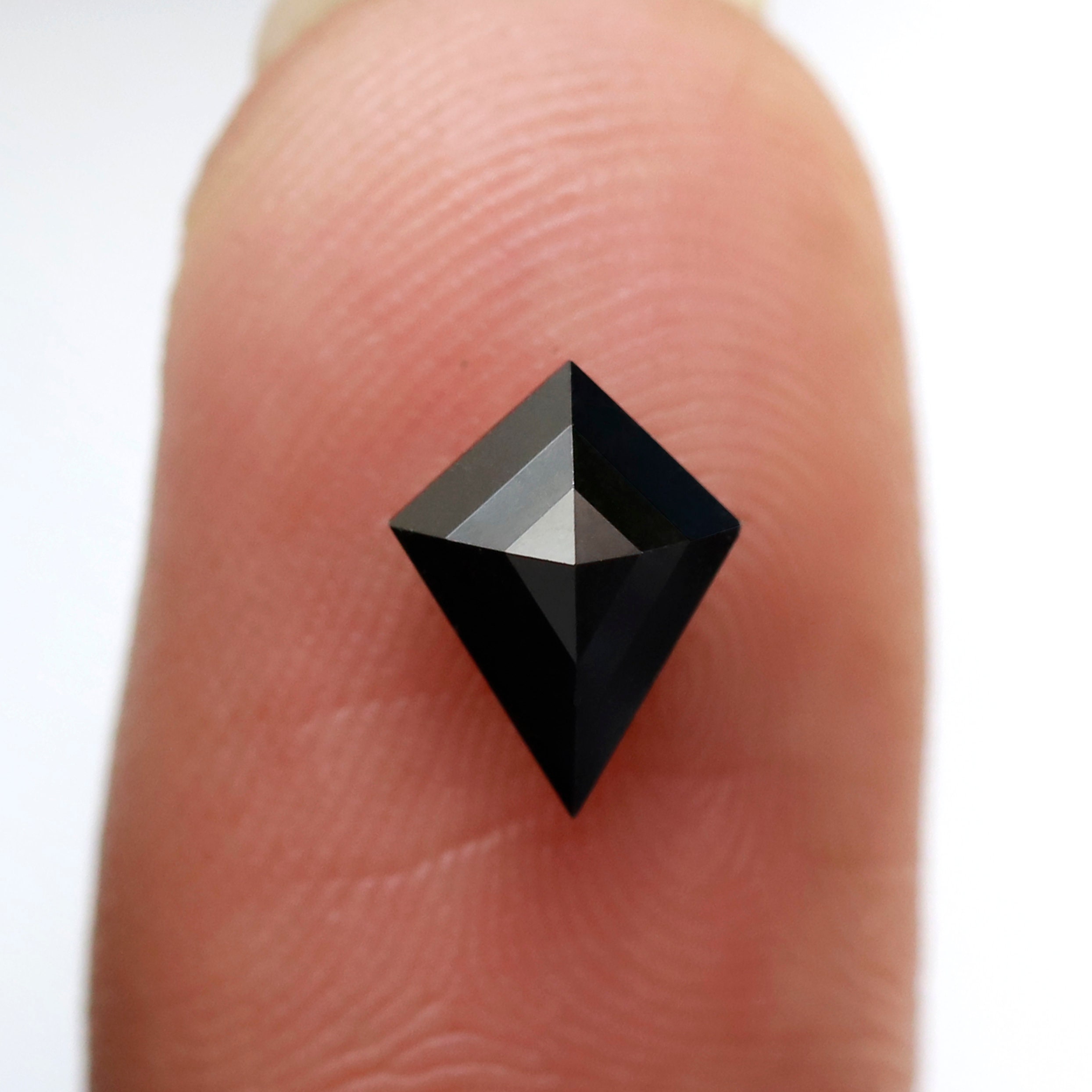 black diamond kite on finger