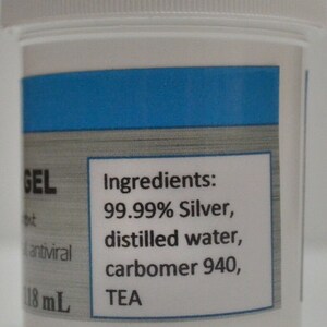 May include: A white plastic bottle with a blue label that reads "GEL" and "Ingredients: 99.99% Silver, distilled water, carbomer 940, TEA". The bottle contains 118 mL of liquid.