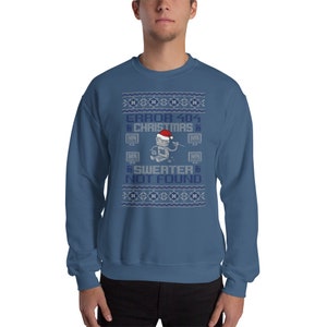 May include: A blue sweatshirt with a white and gray Christmas sweater design. The design features a robot wearing a Santa hat and the text "ERROR 404 CHRISTMAS SWEATER NOT FOUND".
