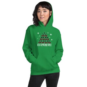 May include: A green hoodie with a white snowflake pattern and a Christmas tree design made of sunglasses. The text "OH OPTOMETREE" is printed below the tree.