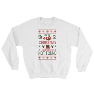 May include: White Christmas sweater with a red and green pixelated design. The sweater has the text "ERROR 404 CHRISTMAS SWEATER NOT FOUND".