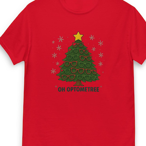 May include: Red t-shirt featuring a Christmas tree design made of green glasses and red frames, topped with a yellow star. The text "OH OPTOMETREE" is printed below the tree, with snowflakes around it.