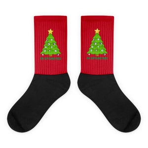 May include: A pair of red and black socks with a green Christmas tree design. The tree has eyes and the text "Oh Optometristree" is printed on the socks.