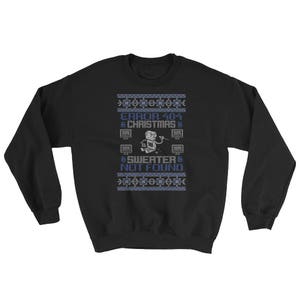 May include: Black sweatshirt with a blue and white pixelated design. The design features a robot holding a wrench and the text "ERROR 404 CHRISTMAS SWEATER NOT FOUND".