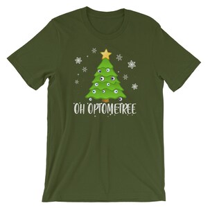 May include: A green t-shirt with a Christmas tree design. The tree has eyes instead of ornaments and the text "Oh Optometree" is printed below the tree.