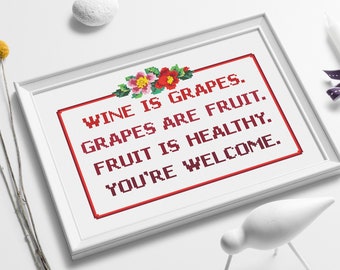 Può includere: Punto croce incorniciato di bianco con testo rosso che dice "Il vino è uva. L'uva è frutta. La frutta è sana. Prego."