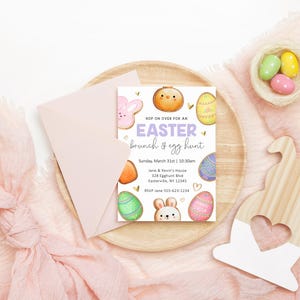 May include: An Easter brunch and egg hunt invitation with a pastel purple, yellow, and green color scheme. The invitation features a bunny, eggs, and a donut. The text reads "Hop on over for an Easter brunch & egg hunt. Sunday, March 31st | 10:30am. Jane & Kevin's House, 128 Eggplant Blvd, Easterville, NY 12341. RSVP Jane 555-423-1234."