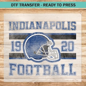 May include: A blue and white graphic design with the text "Indianapolis Football" and the numbers "19" and "20". A blue football helmet with a white face mask is in the center of the design.