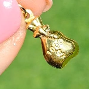 Ciondolo/ciondolo vintage a forma di sacco porta soldi in oro 9 ct e 1000 dollari. Gioielli/gioielleria vintage.