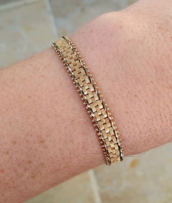 At Auction: A 14ct gold fancy-link bracelet, with pu