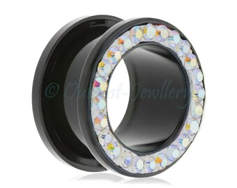 May include: Black ear tunnel with a ring of iridescent crystals. The jewelry is a plug style, designed to stretch the earlobe. The tunnel is made of a solid black material and has a smooth, polished finish.