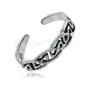May include: A silver-colored toe ring with an open design. The ring features an intricate Celtic knot pattern and is adjustable. The jewelry is displayed on a white background.