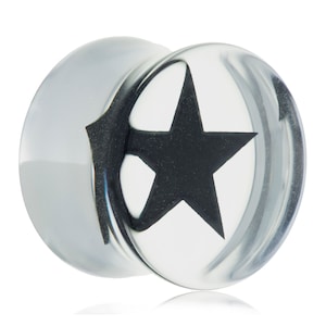 May include: Clear, round ear plug with a black star design. The plug is made of a transparent material, allowing light to pass through. The star is centered within the plug, creating a bold contrast. This body jewelry is suitable for stretched ear piercings.