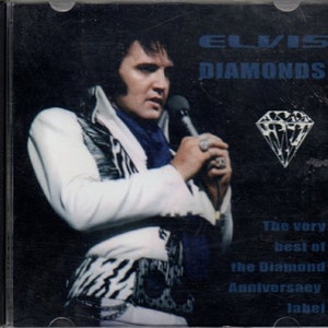 May include: A black and white CD case with a photo of Elvis Presley singing into a microphone. The text "ELVIS DIAMONDS" is in white letters on a black background. The text "The very best of the Diamond Anniversary label" is in white letters on a blue background.