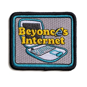 May include: Embroidered patch featuring a laptop design with the text "Beyonce's Internet" in yellow. The patch has a gray background with a teal and black border, and a white laptop outline.