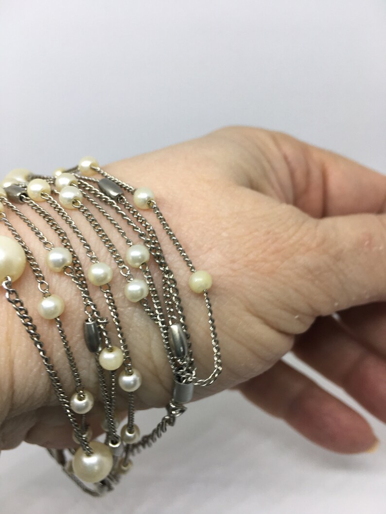 Gift or keep for yourself! Multi-Strand Silver Tone Necklace with faux Pearl and Silver Toned Beads Pearls are big for spring and summer