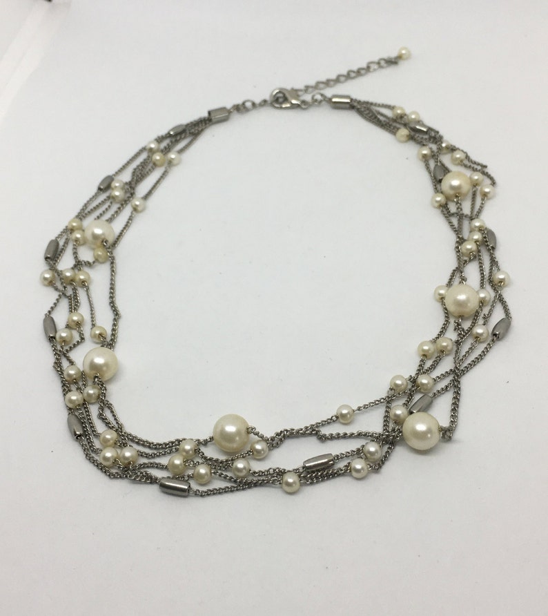 Gift or keep for yourself! Multi-Strand Silver Tone Necklace with faux Pearl and Silver Toned Beads Pearls are big for spring and summer