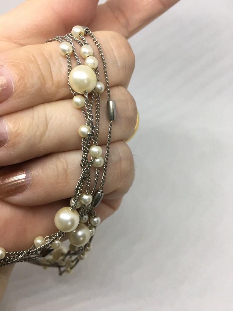 Gift or keep for yourself! Multi-Strand Silver Tone Necklace with faux Pearl and Silver Toned Beads Pearls are big for spring and summer