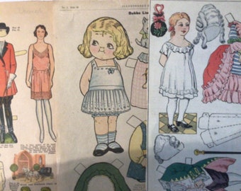 May include: A vintage paper doll set featuring a young girl in a white dress with blue trim. The set includes a variety of outfits and accessories, including a hat, a purse, and a pair of shoes. The paper doll set is printed on cream-coloured paper.