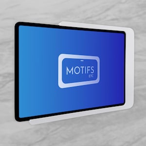 May include: A white rectangular wall mount holding a tablet with a blue screen. The screen displays a white rectangular icon containing the text MOTIFS ETC in a sans-serif font. The mount features a clean, solid frame design for device display.