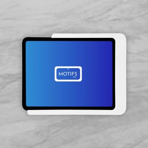 May include: A black tablet with a blue screen displaying the text "MOTIFS ETC" in a white rectangle. The tablet is set in a white holder against a gray marble background.